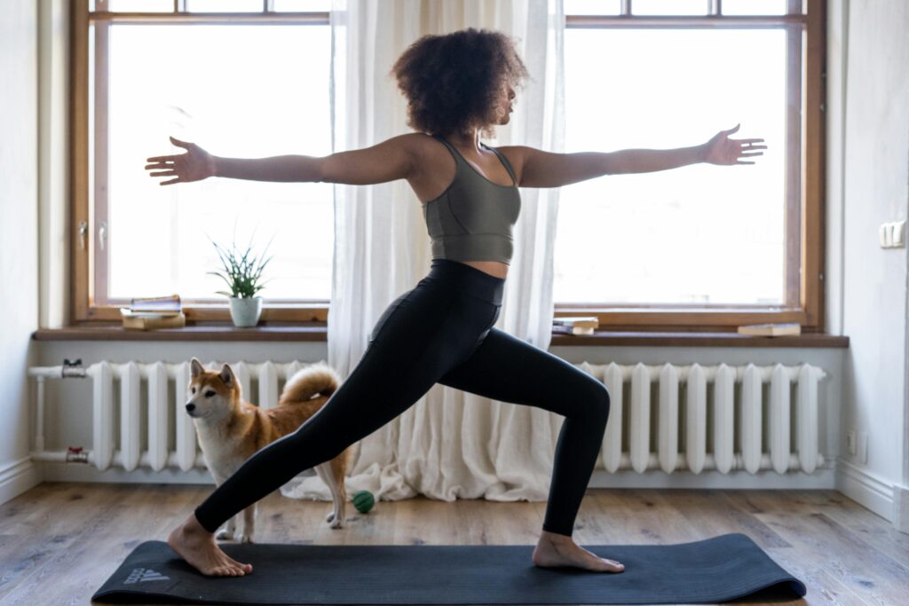 Lady doing yoga by the window