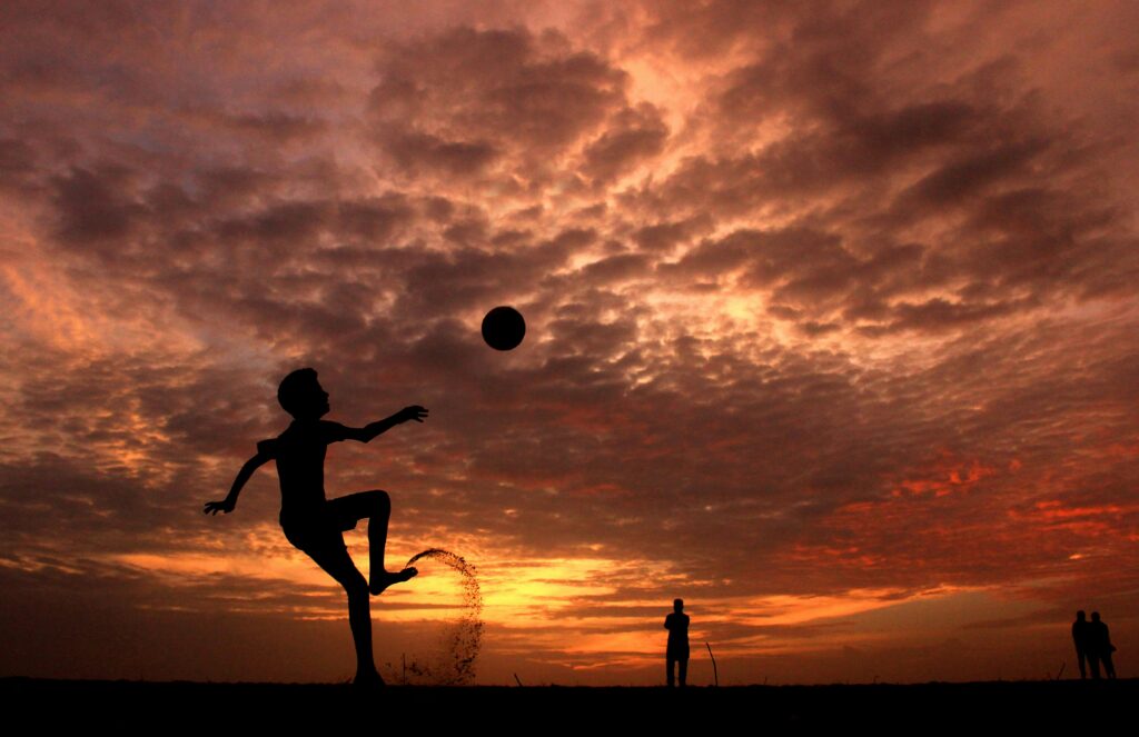 Playing on the beach at sunset