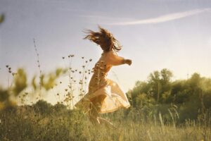 Woman dancing in the field